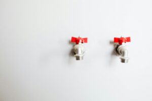 Faucets on White Wall